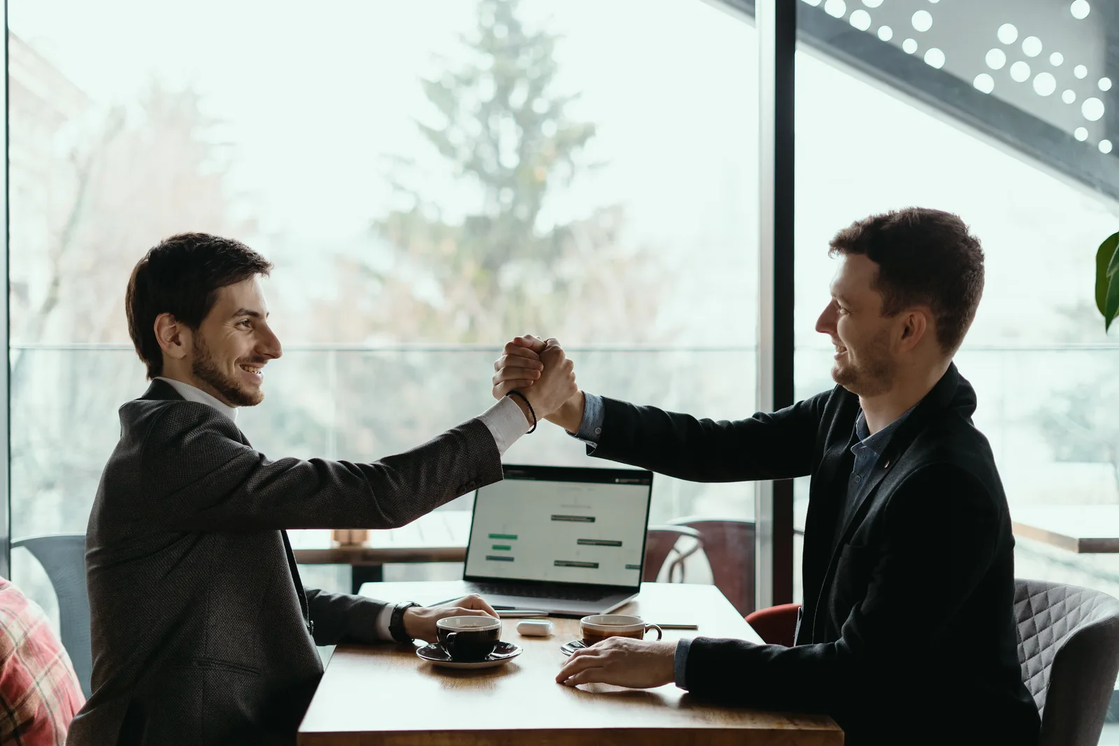 Business partners shaking hands on a corporate sponsorship deal