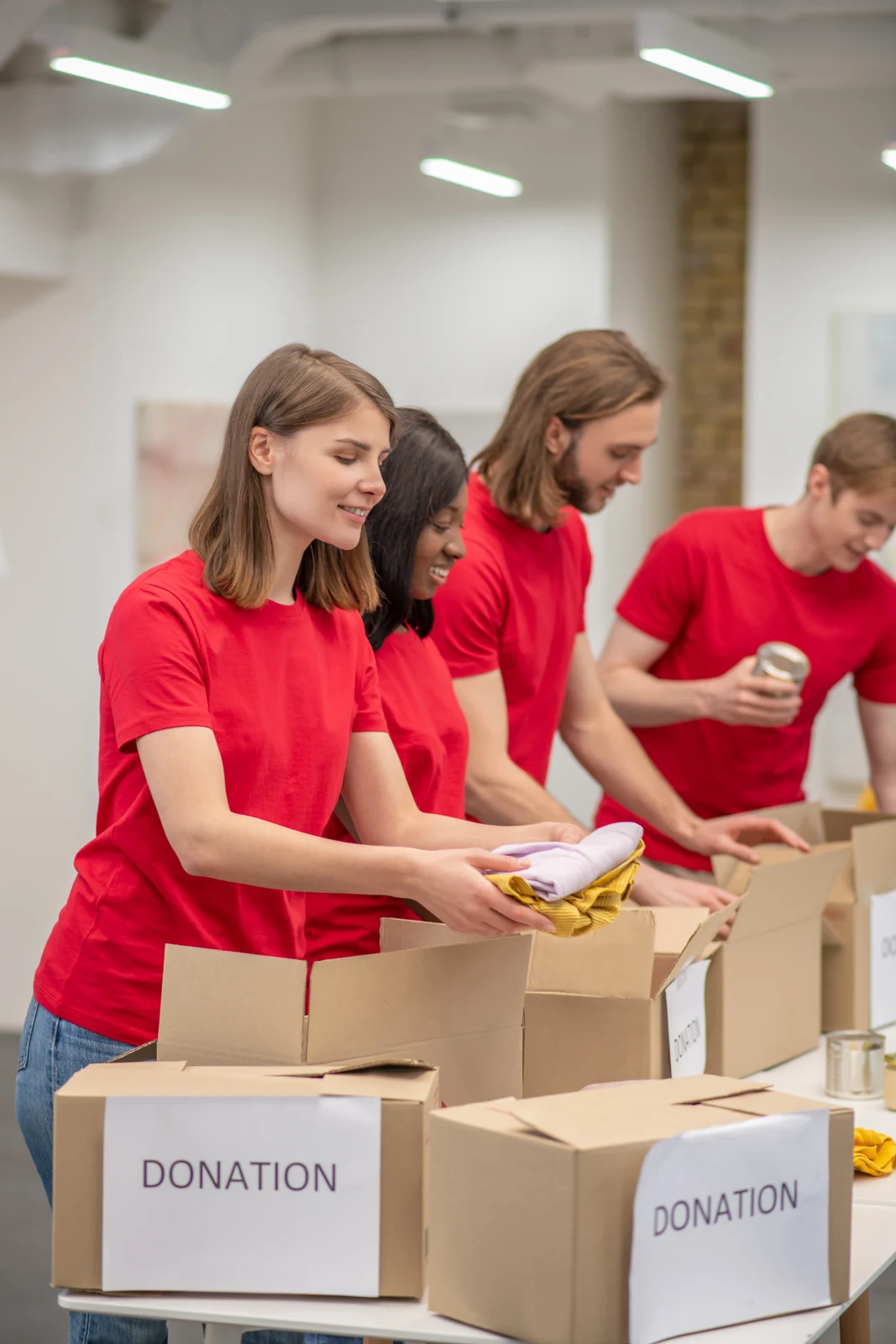 Volunteers packing donation boxes, one of many fundraising ideas for nonprofits